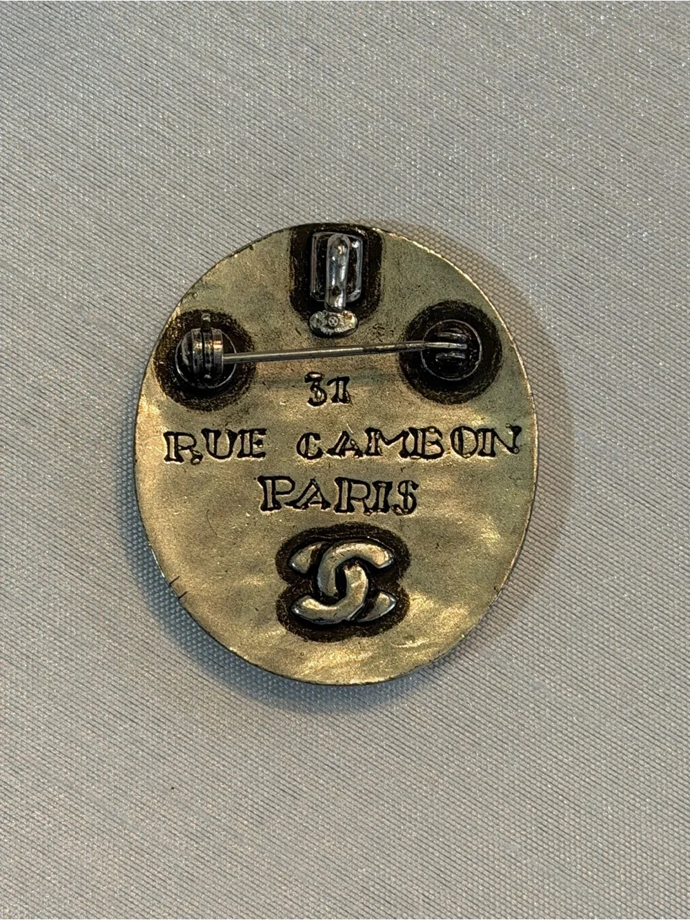 Vintage CHANEL Rue Cambon Paris Silver-Tone Oval Brooch with Gripoix Stones